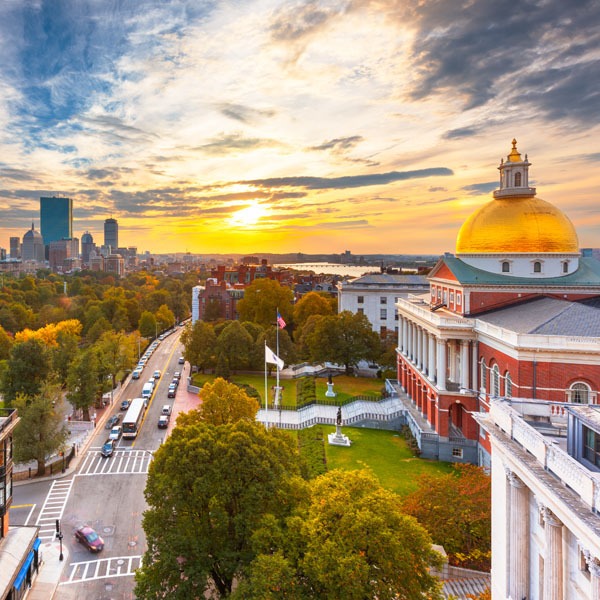 View of Boston Massachusetts downtown area showing gold dome on right and city scape on left.